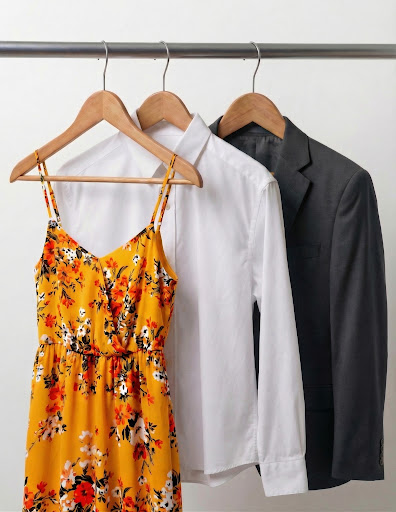 Clean colorful garments on hangers